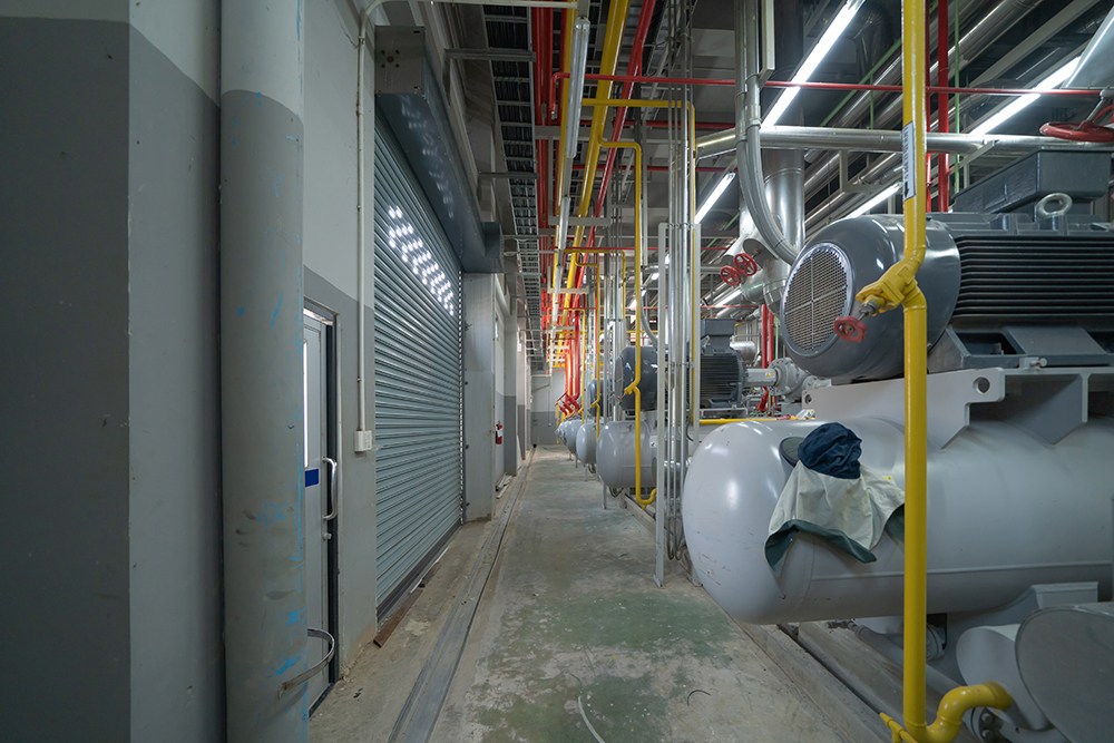 Inside of Industry factory. Chiller tower or cooling tower in building. System work machine. Condenser Water Supply and return pipe lines. Ventilation compressor. Water system in workshop.