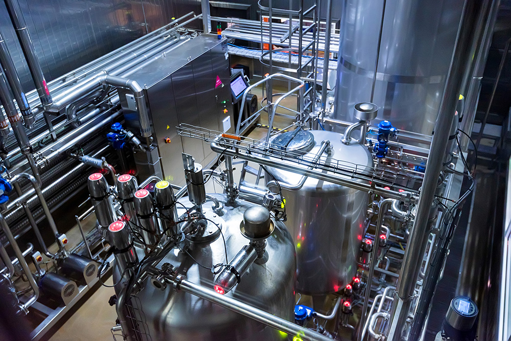 Metal reservoirs at a soft drink factory